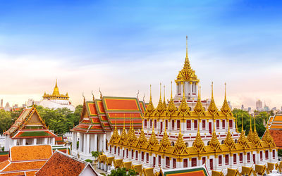 View of temple building against cloudy sky