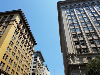 Low angle view of buildings against clear sky