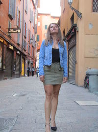 Full length of woman standing in city