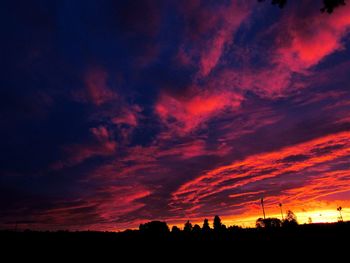 Silhouette of landscape against cloudy sky