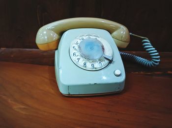 High angle view of telephone on table