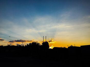 Silhouette of built structure at sunset