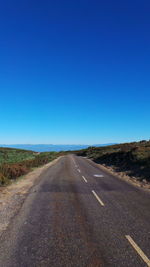 Empty road along landscape