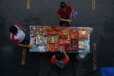 High angle view of people sitting at market