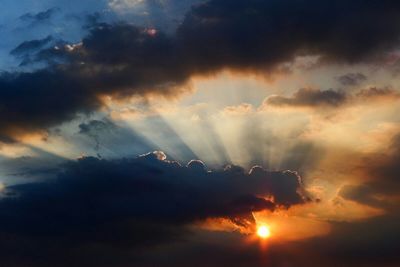 Low angle view of cloudy sky at sunset