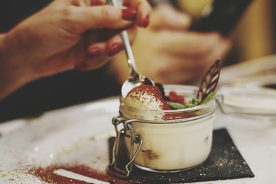 Close-up of hand holding ice cream