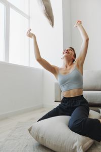 Young woman doing yoga at home