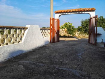 Built structure on landscape against sky