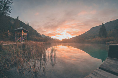 Scenic view of lake against sky during sunset