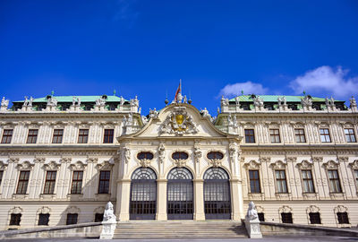 Low angle view of building against blue sky