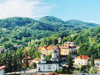 High angle view of townscape and trees against sky