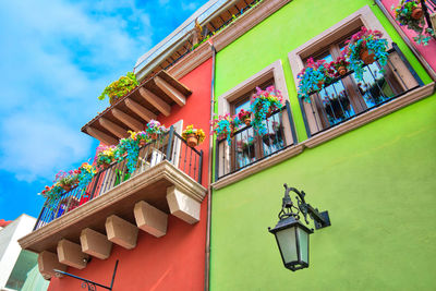 Low angle view of multi colored sculpture against building