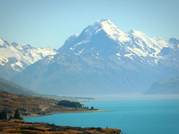 Snowcapped mountains with lake in foreground