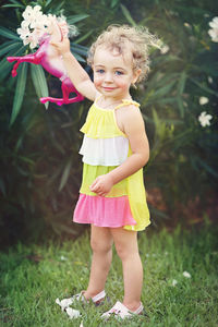 Portrait of a girl with pink flower