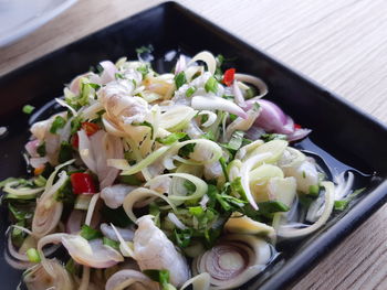 High angle view of chopped vegetables in bowl on table