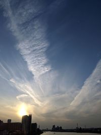 Low angle view of buildings against sky during sunset