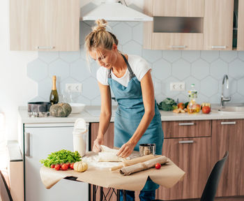 Woman eating food at home