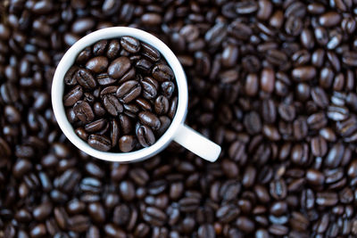 High angle view of roasted coffee beans in cup
