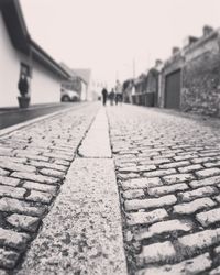 Close-up of cobblestone against clear sky