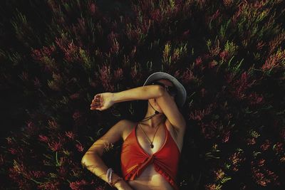 Portrait of young woman standing on field