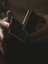 Close-up of man holding woman hand