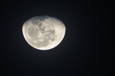 Low angle view of moon against sky at night