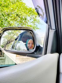 Portrait of man sitting in car