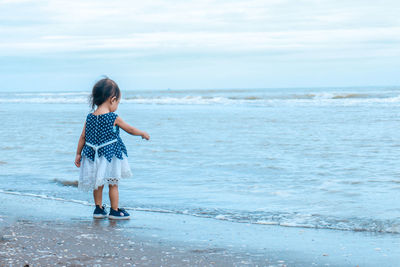 Little girl by the beach