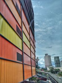 Residential buildings in city against sky