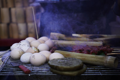 Grilled chicken eggs being cooked by local from ha giang, vietnam