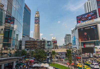 City street and buildings against sky