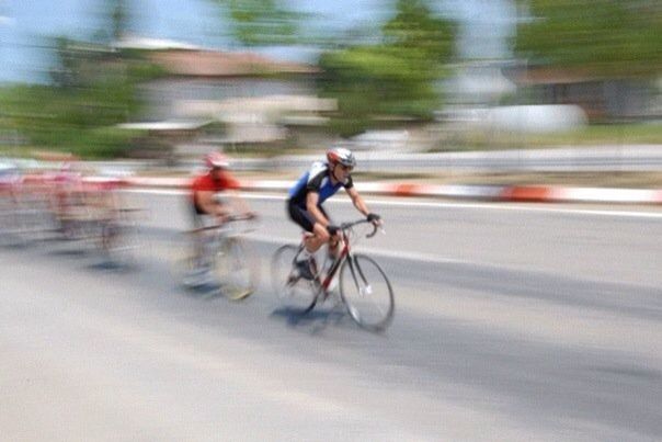 transportation, motion, bicycle, blurred motion, riding, mode of transport, on the move, full length, road, land vehicle, street, speed, lifestyles, leisure activity, cycling, walking, running, side view