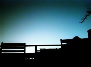 Low angle view of illuminated building against clear sky