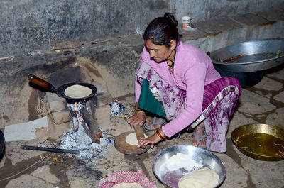 High angle view of woman holding umbrella