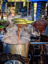 Man preparing tea at market