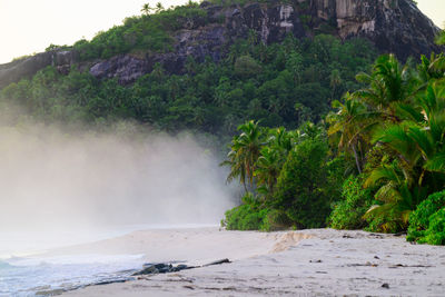 Scenic view of sea against mountain