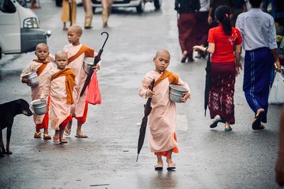 People walking on street in city