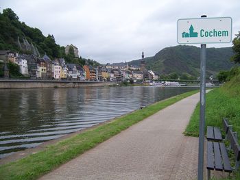 View of road sign by river