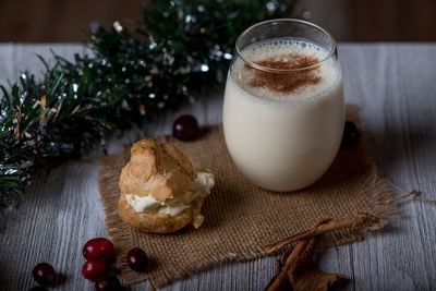 Close-up of eggnog in glass on table