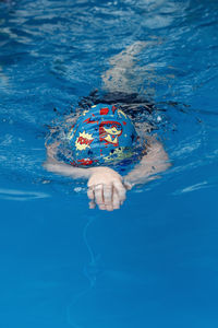 Person swimming in pool