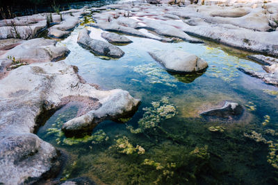 High angle view of rocks in lake