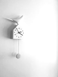 Wall clock hanging on wall