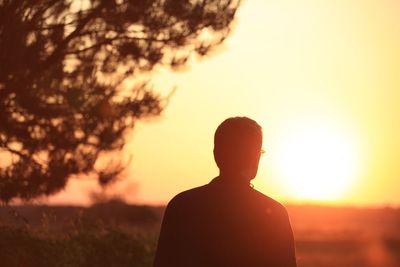 Silhouette of woman at sunset