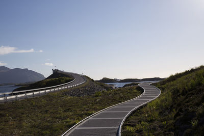 Scenic view of winding road against sky