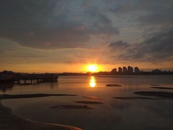 Scenic view of sunset over city