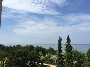 Scenic view of sea against cloudy sky