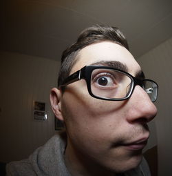 Fish eye view of young man wearing eyeglasses