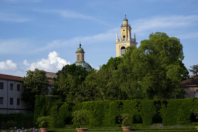 Scenic wiev ot italian historical gardens with baroque bells tower. tourism concept