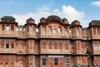 Low angle view of historical building against cloudy sky