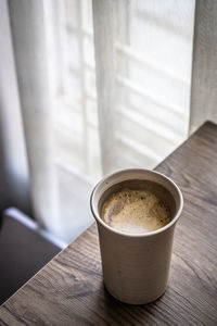 Close-up of coffee cup on table